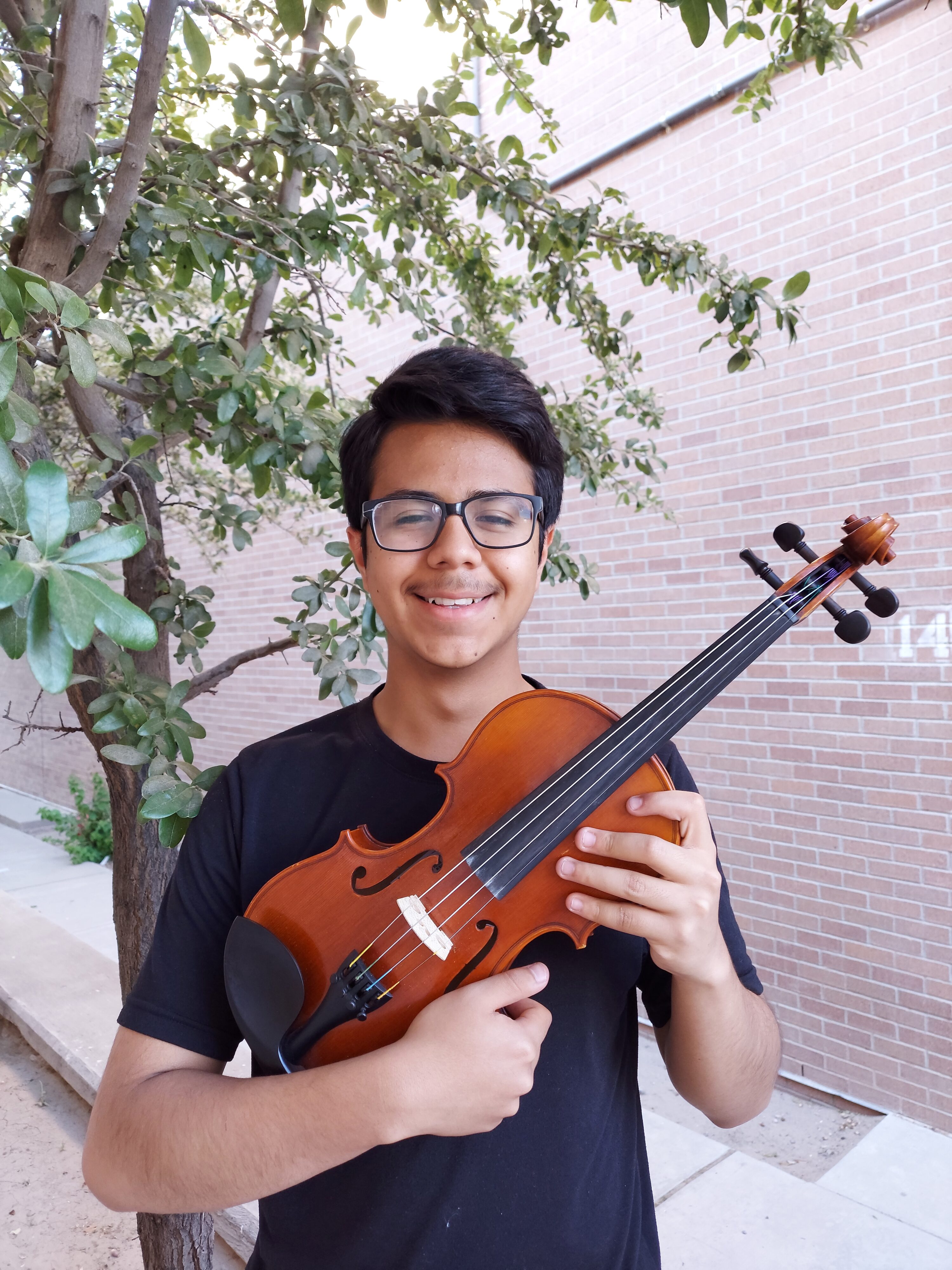 Young man holding a violin
